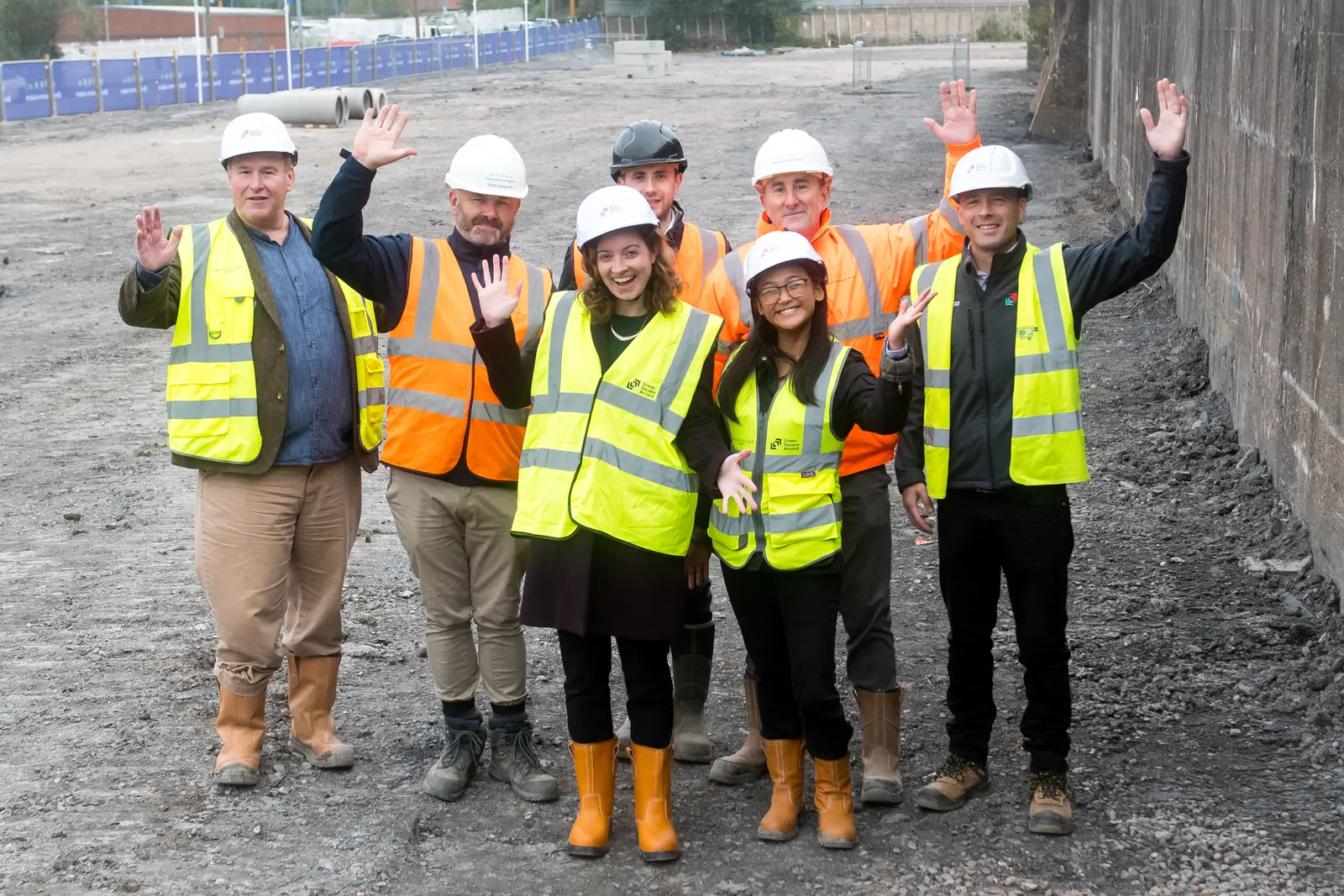 GreenSquareAccord colleagues wearing high-visibility vests and hard hats celebrating the start of the Swan Lane development