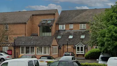 A large residential complex with communal parking